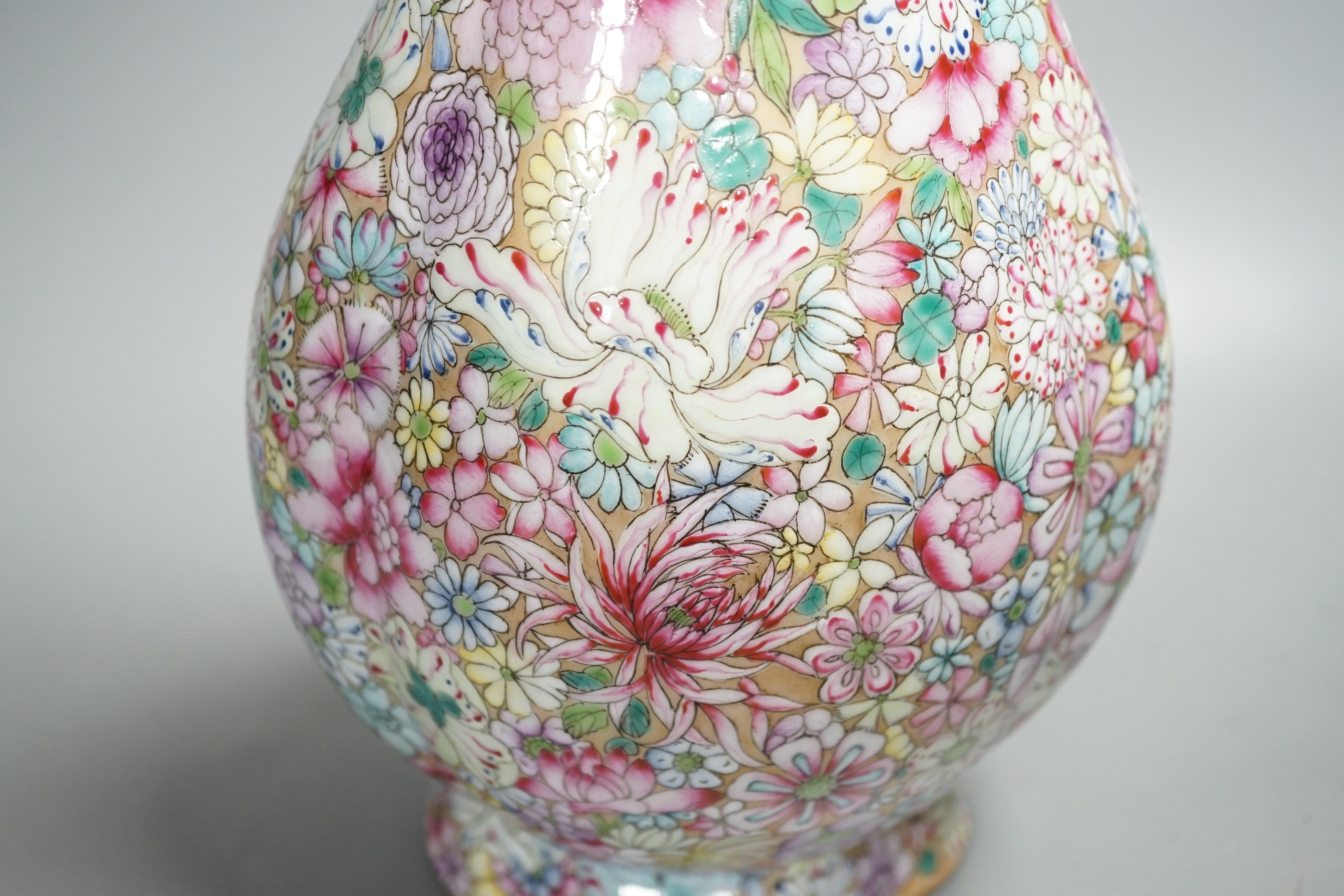 A Chinese famille rose millefleur 2 handled vase, 36cms high.